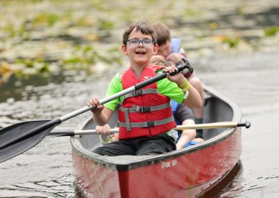 Camper paddles a canoe for the first time and feels a sense of pride and accomplishment.