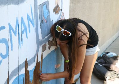 Camper refreshes paint on pool door, taking pride in beautifying camp!